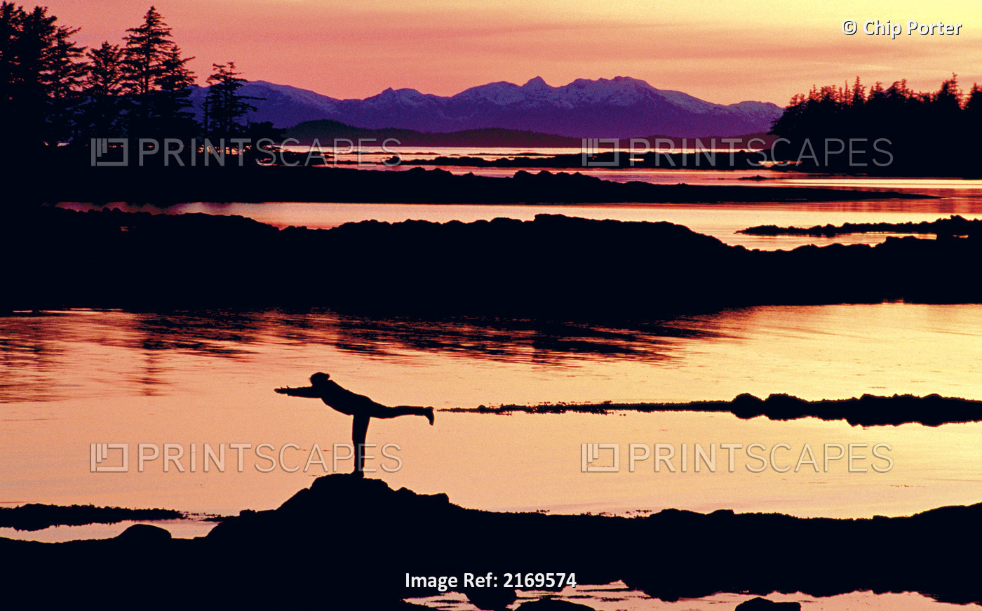 Woman Doing Yoga On A Rocky Beach, Duke Island, Southeast, Alaska