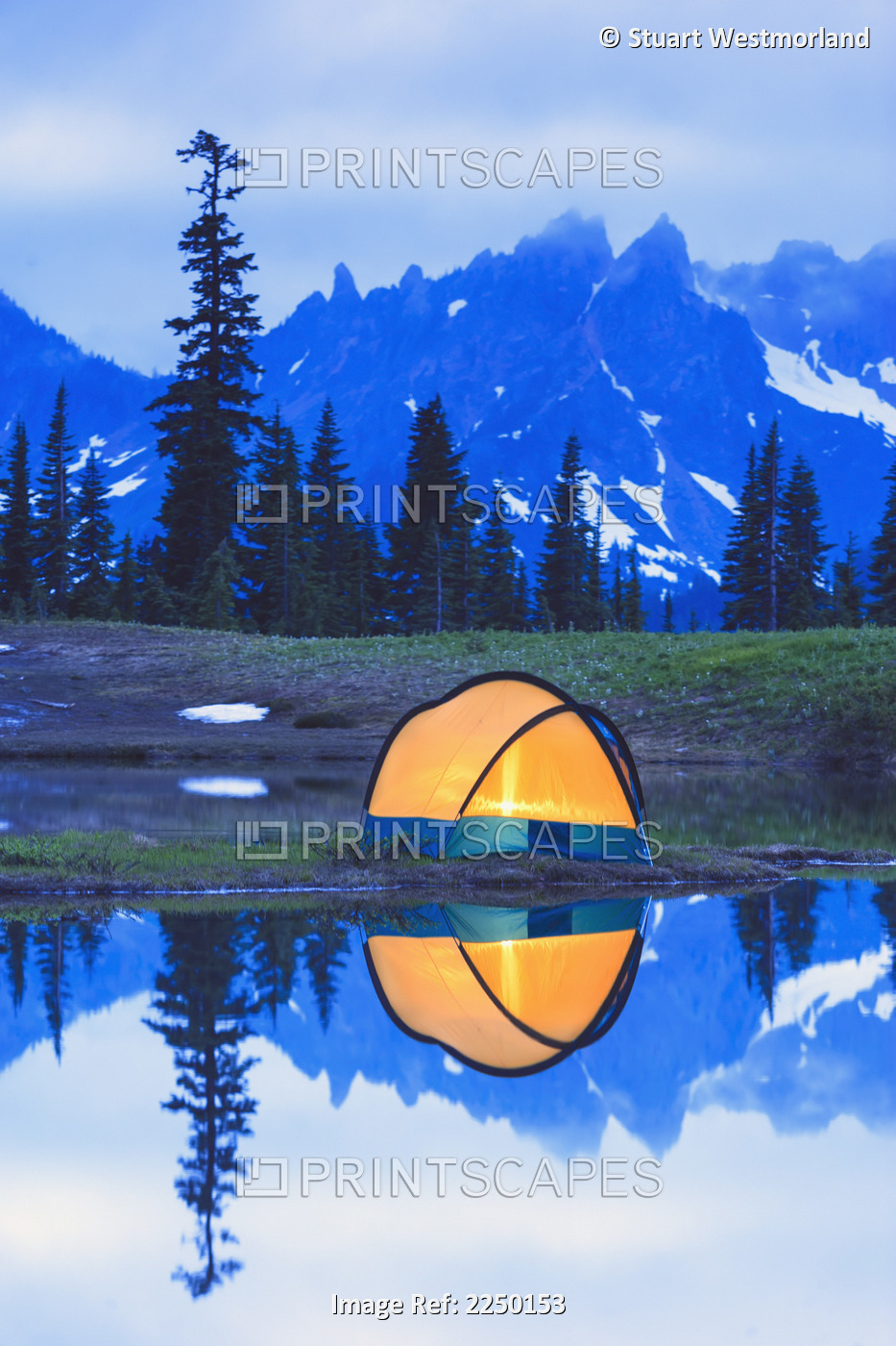 Camping tent at sunset small reflecting pond near tipsoo lake mount rainer ...