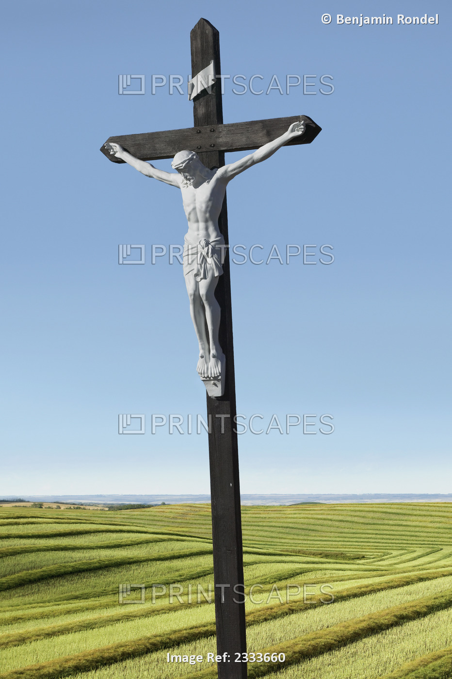 A crucifix on farmland;Saskatchewan canada