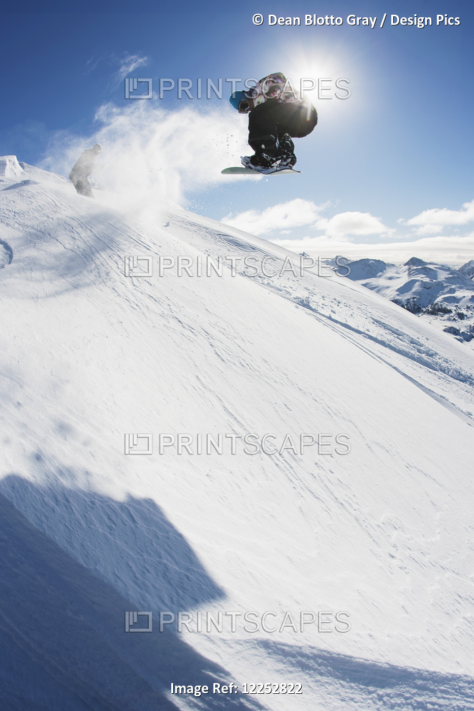 Professional Snowboarder Making A Jump In Fresh Snow Near Ushuaia, Patagonia, ...