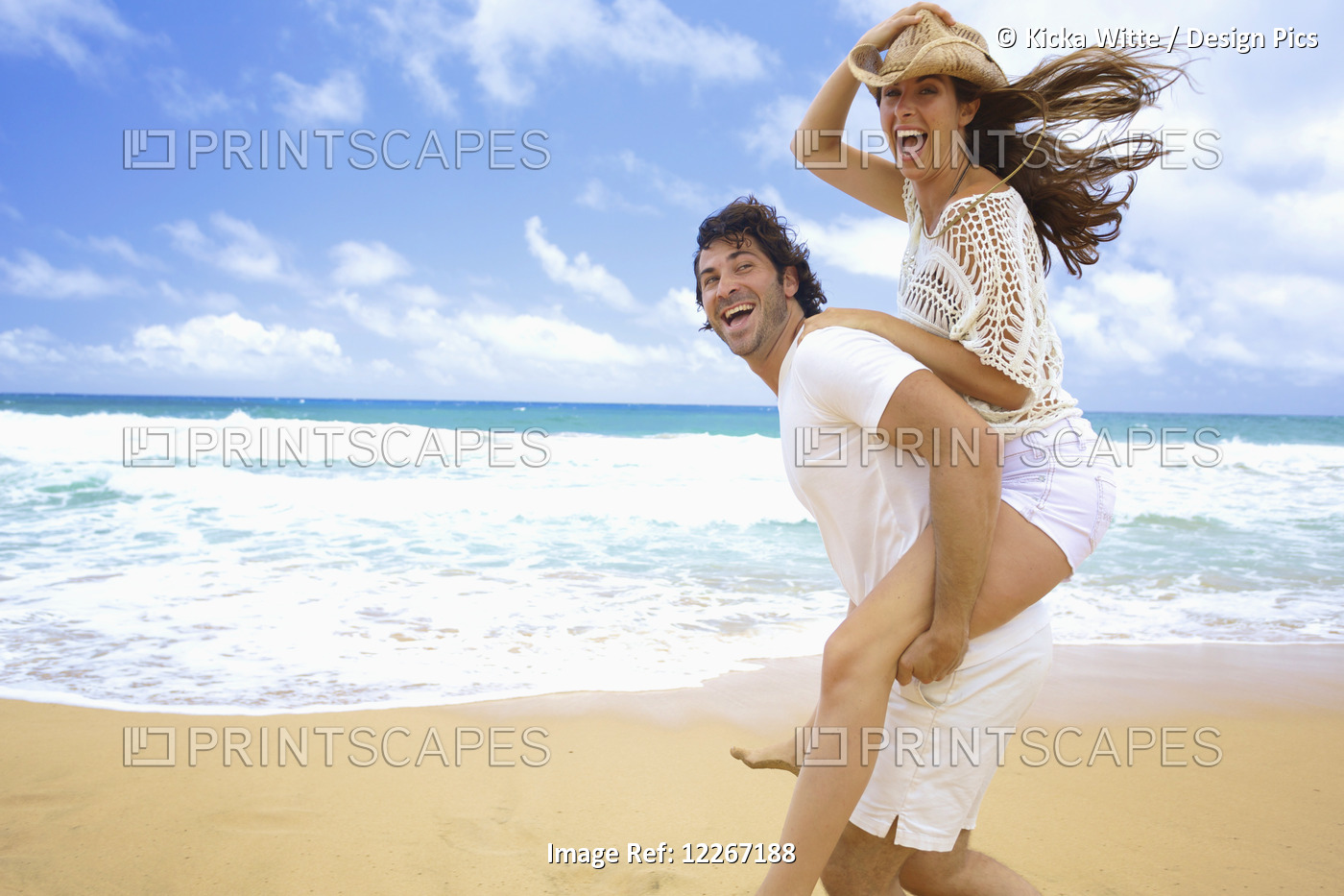 Couple On The Beach; Kealia, Kauai, Hawaii, United States Of America