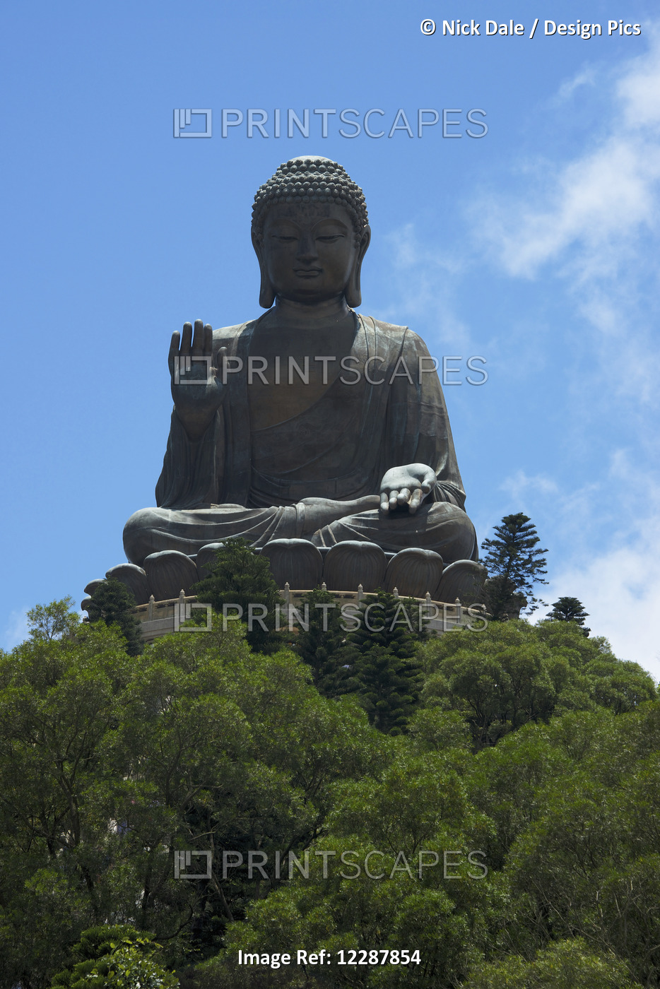 Big Buddha On Hilltop Above Green Trees; Hong Kong