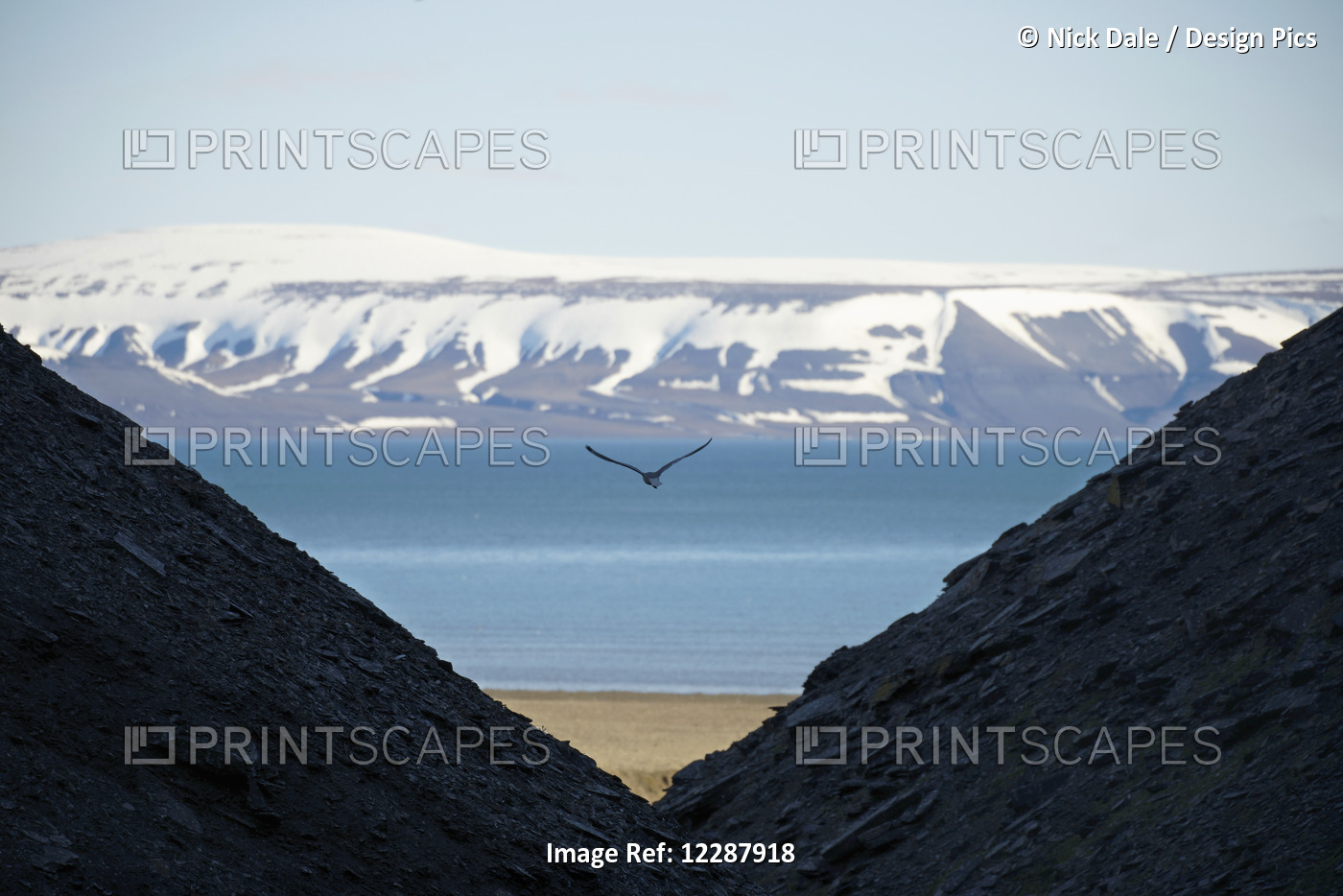 View Through Mountain Slopes To The Beach, Arctic Ocean, Snow Covered Mountains ...