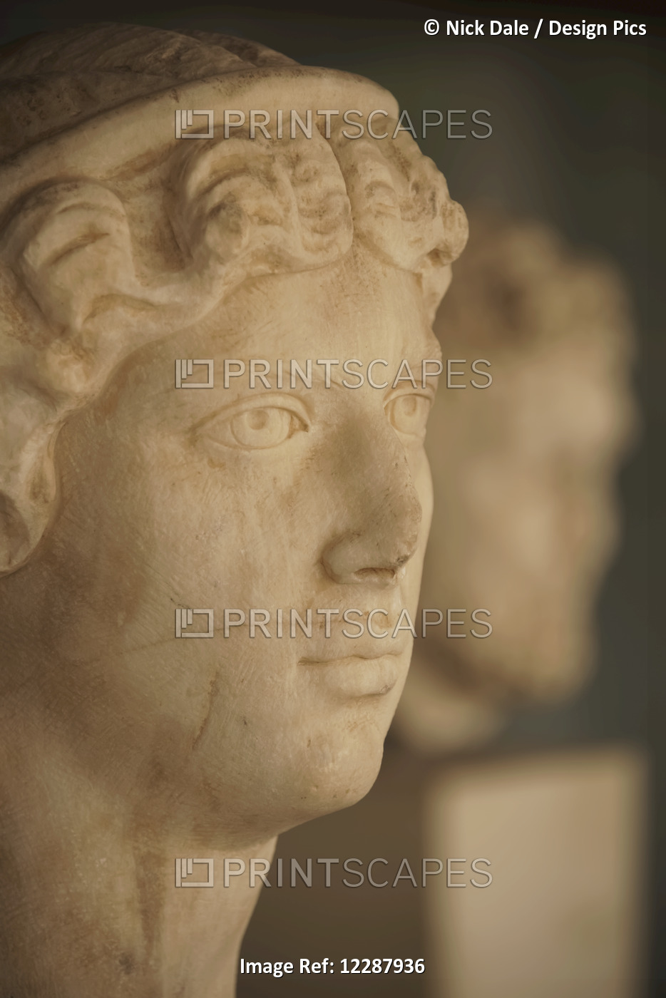 White Marble Head Of Female Statue Beside Male Statue; Athens, Attica, Greece