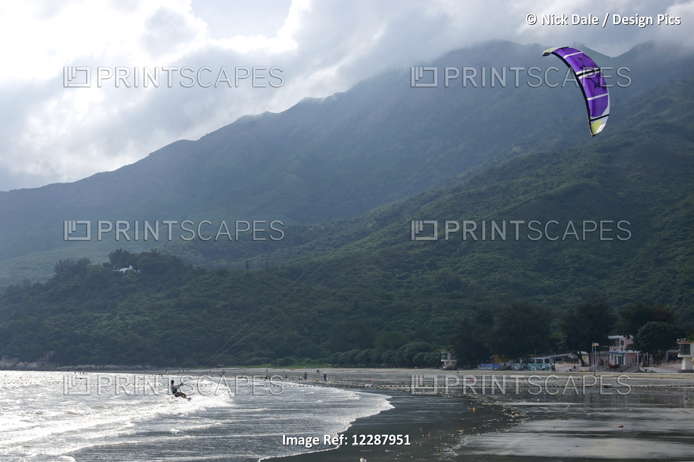 Kite Surfer And Purple Kite Near Beach; New Territories, Hong Kong, China
