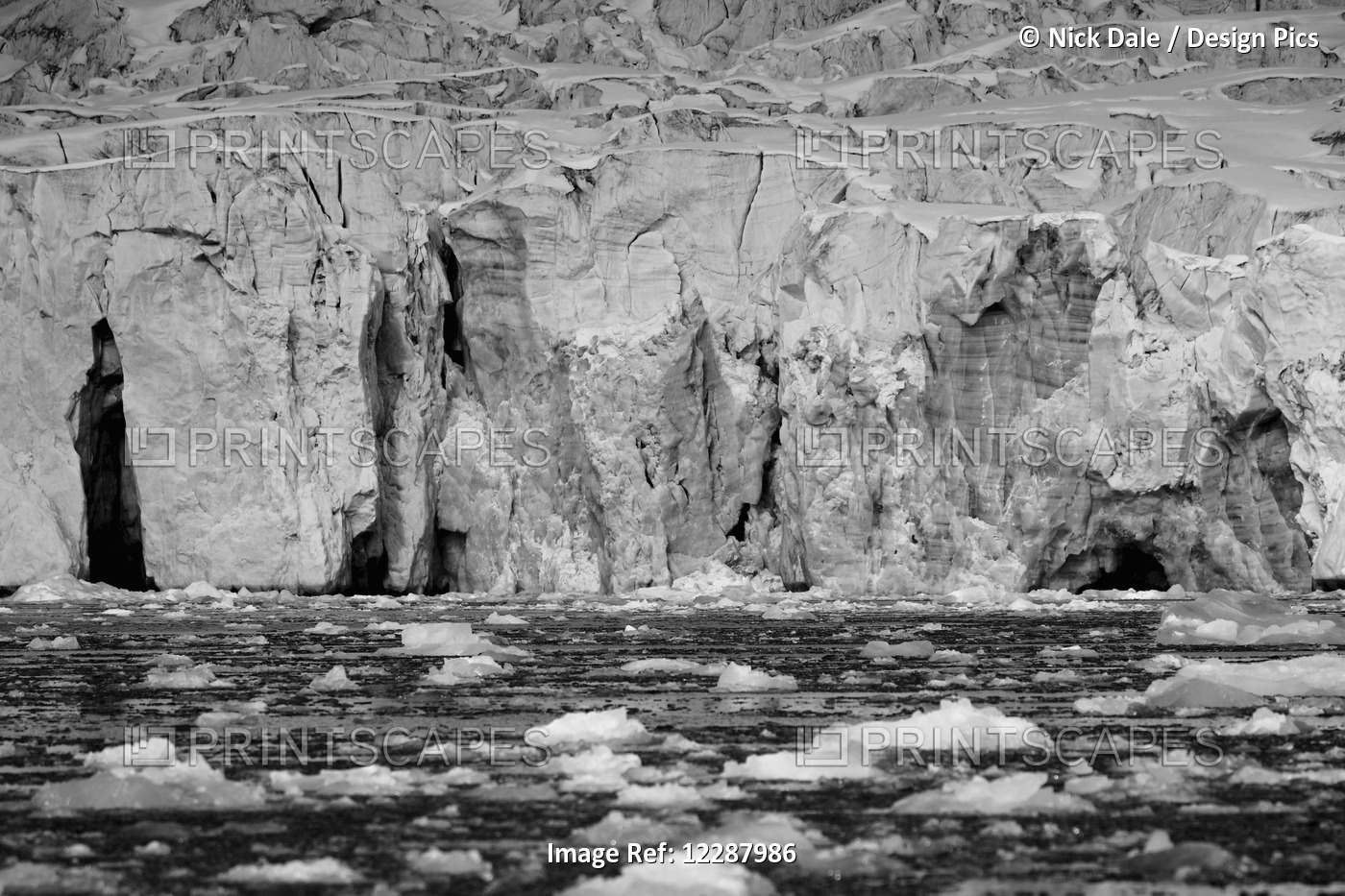 Ice Cliff And Pieces Of Ice Floating, In The Arctic Ocean; Spitsbergen, ...