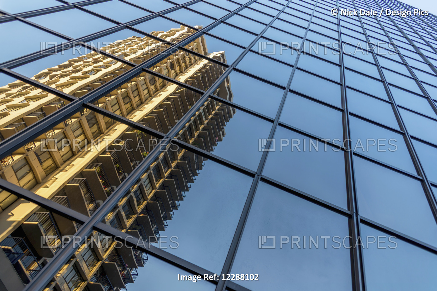 Angled View Of A Skyscraper's Glass Facade From Street Level, Showing The ...