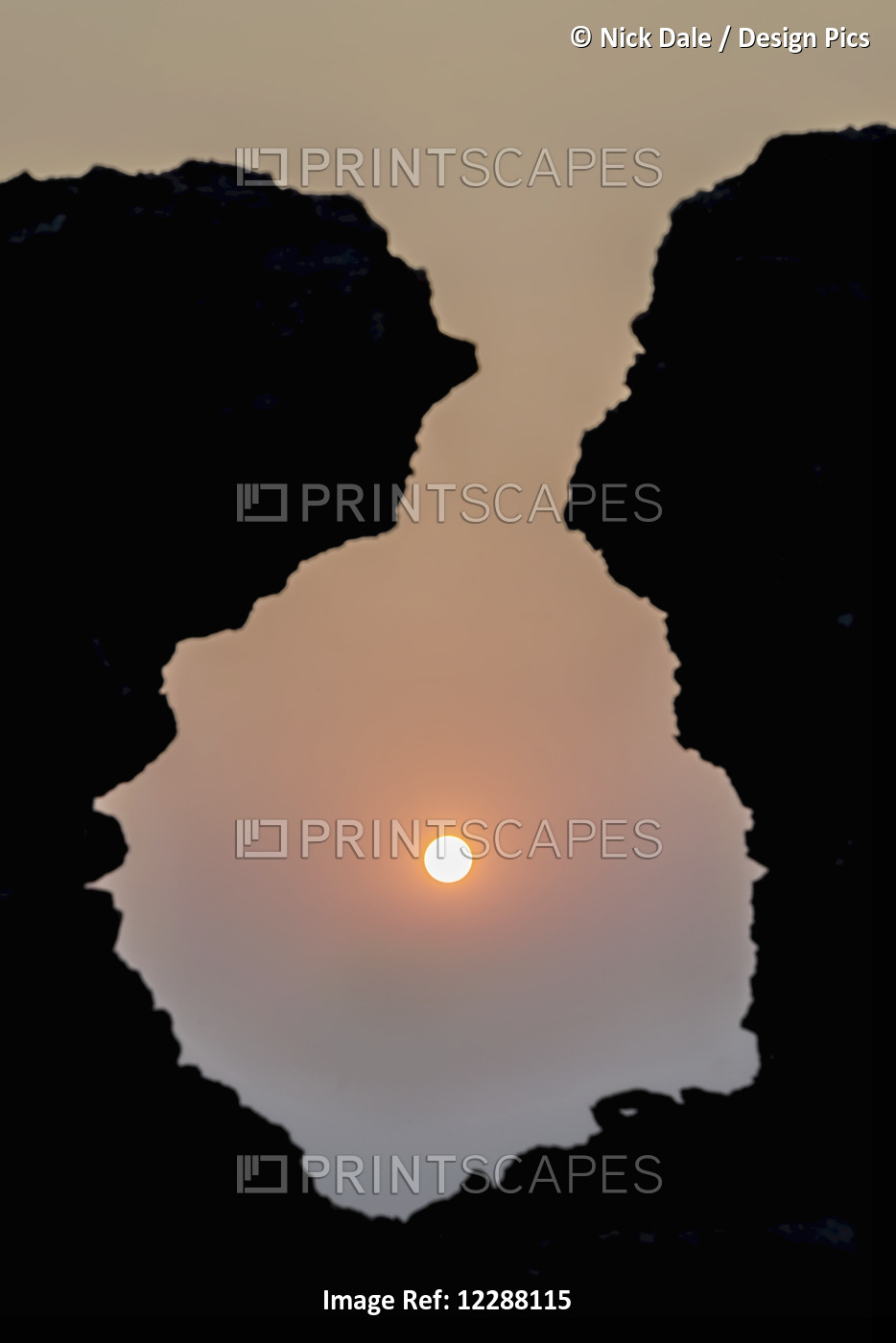 Sunrise Seen Through A Hole In An Old Stone Wall Without A Cloud In The Sky; ...