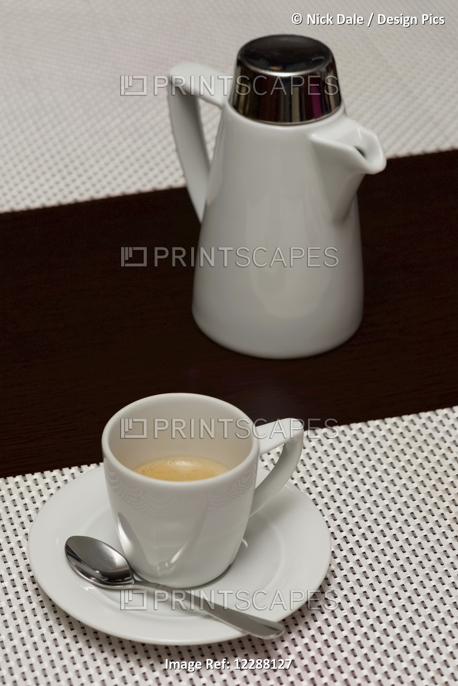 White Espresso Cup With Coffee Beside Pot; Ankara, Turkey