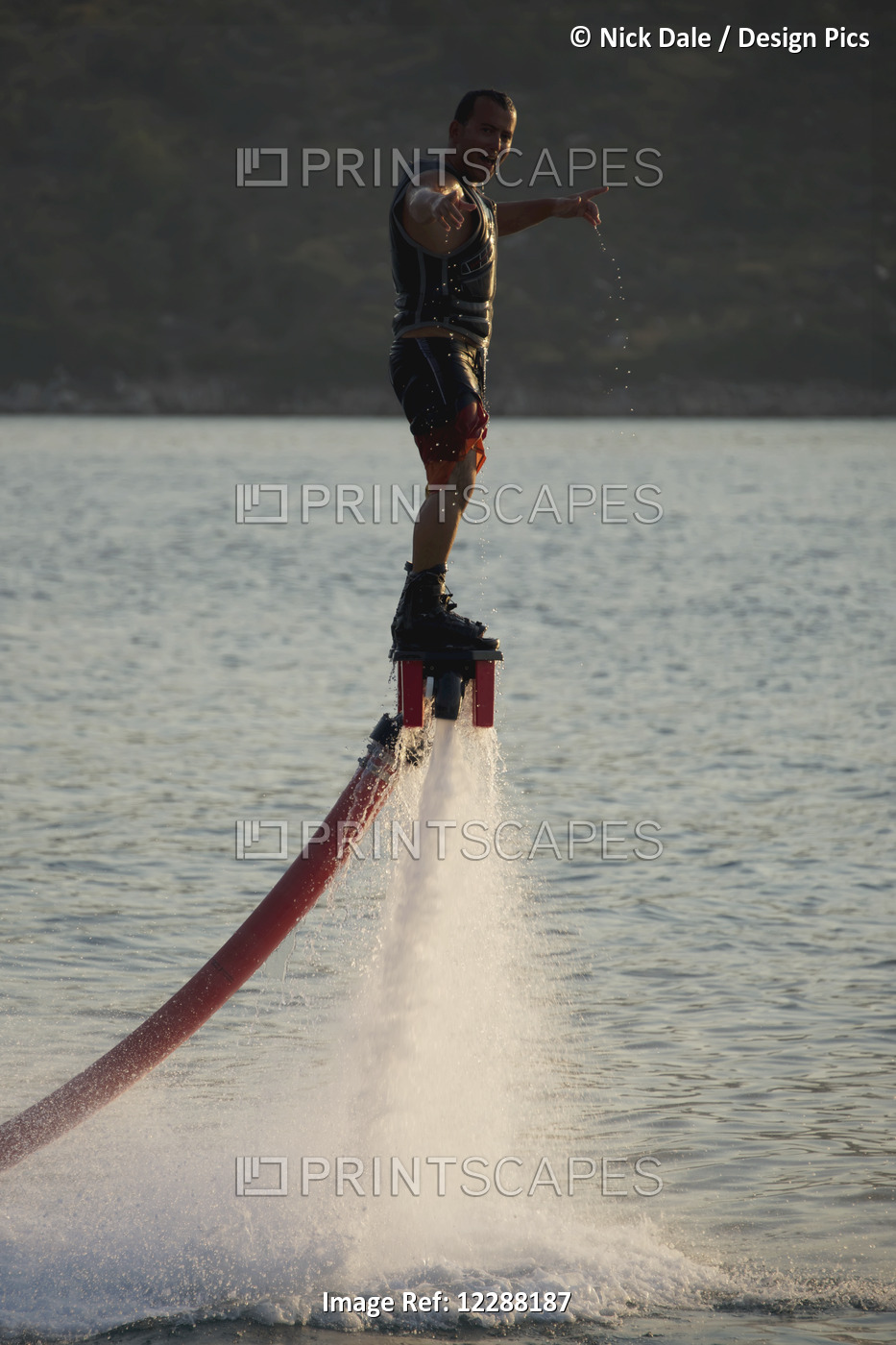 Flyboarder With Arms Out Looking Towards Camera; Torba, Mugla Province, Turkey