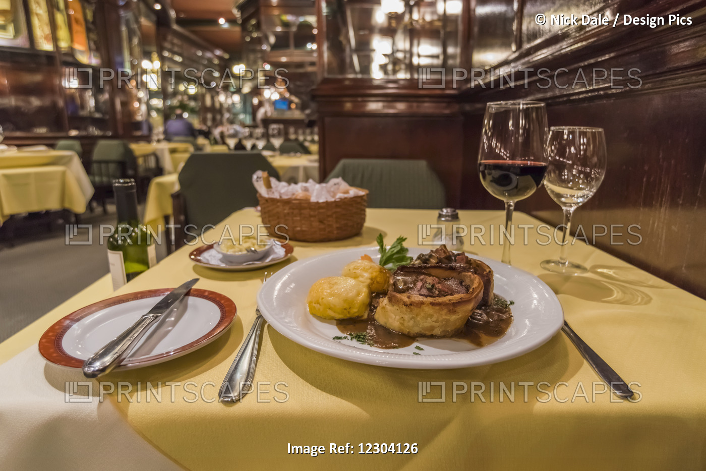 Steak Dinner And Wine On Restaurant Table; Buenos Aires, Argentina