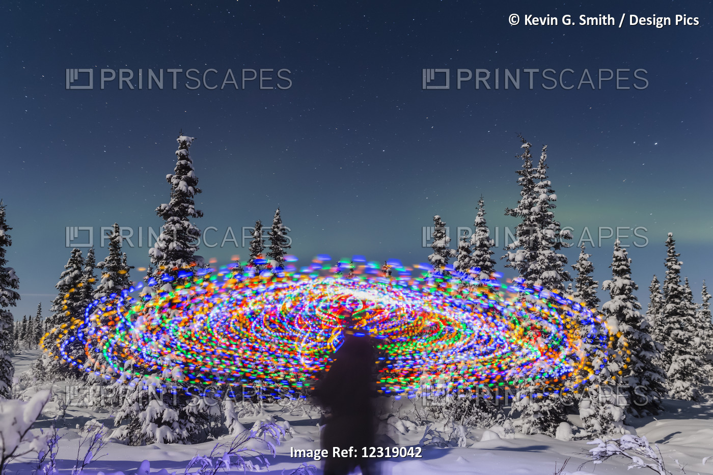 The Aurora Borealis Dances Over The Top Of A Vibrant Spiral Light Painting, The ...