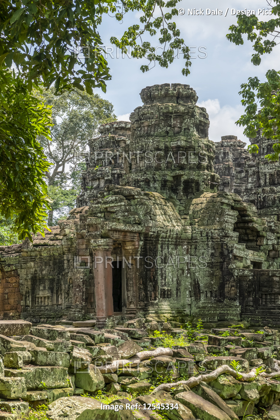Rear entrance of ruined temple in forest, Banteay Kdei, Angkor Wat; Siem Reap, ...