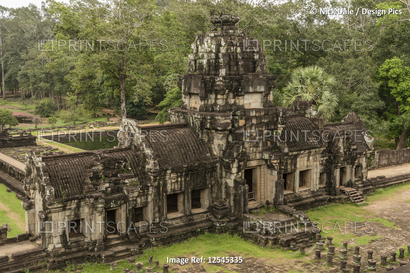 Ruined Baphuon temple in jungle, Angkor Wat; Siem Reap, Siem Reap Province, ...