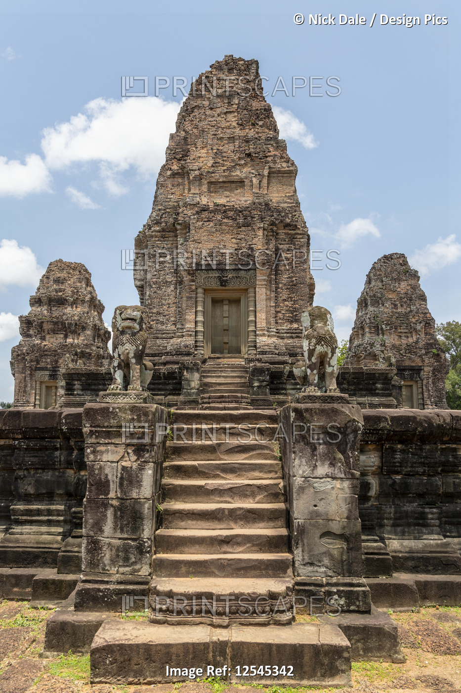 Steps leading to ruined stone temple towers, East Mebon, Angkor Wat; Siem Reap, ...