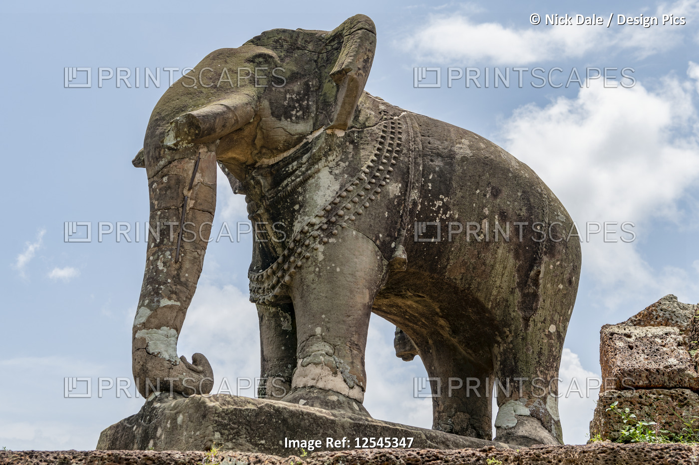 Stone elephant at corner of ruined temple, East Mebon, Chang Puak Camp, Angkor ...