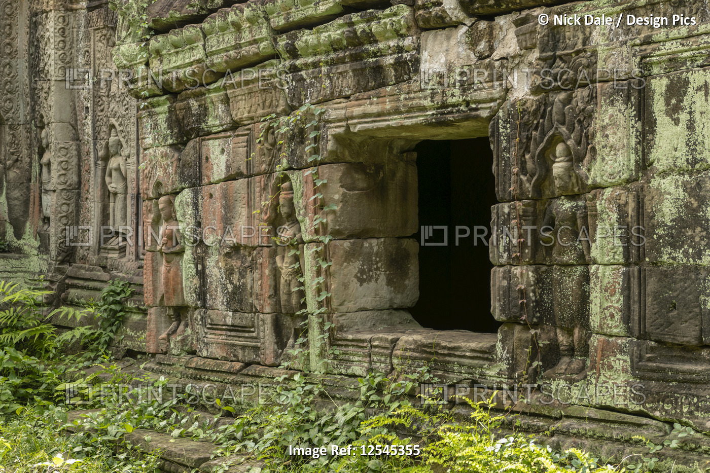 Window in stone wall decorated with bas-reliefs, Preah Khan, Angkor Wat; Siem ...