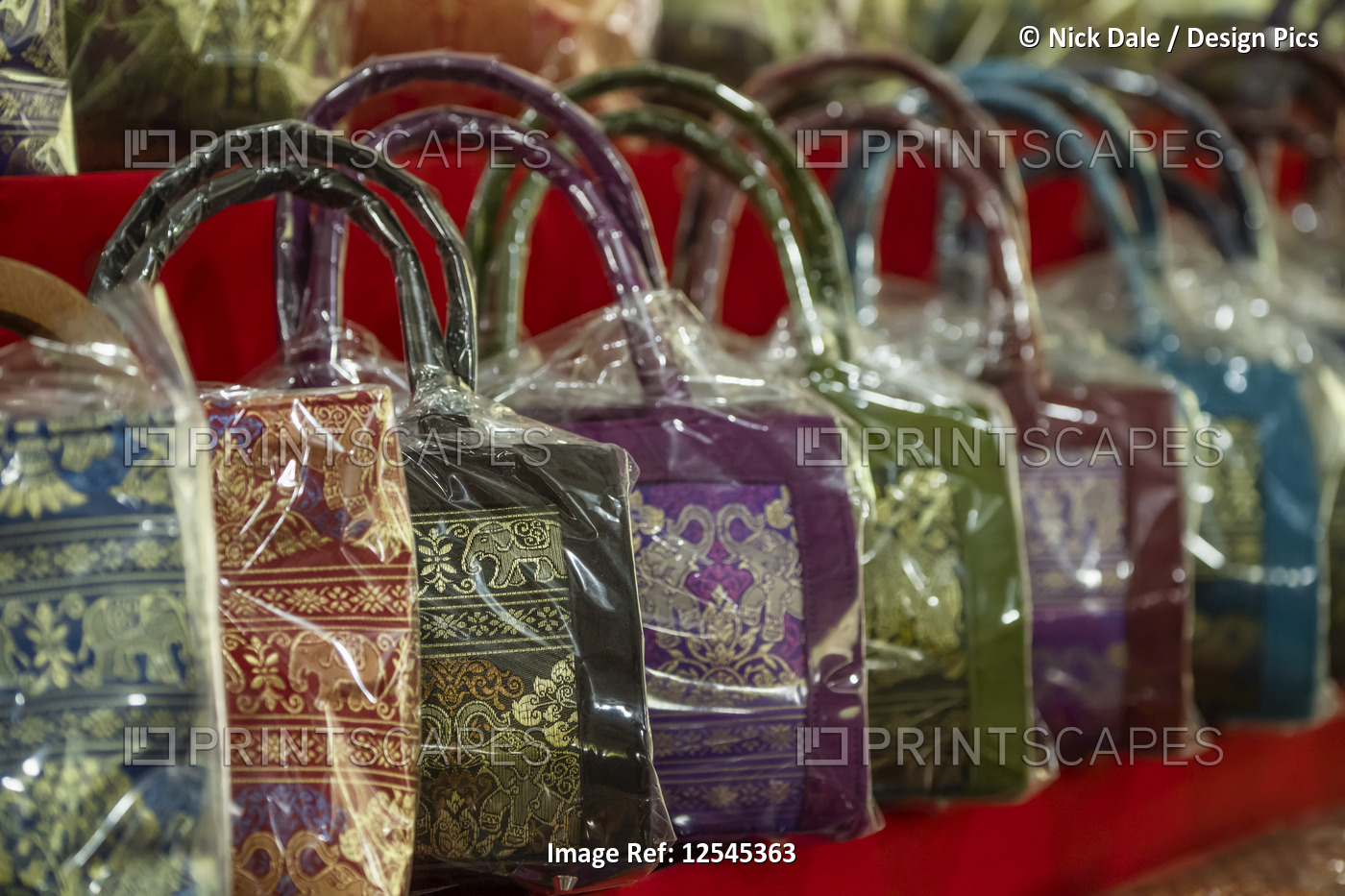 Line of Thai handbags wrapped in plastic; Bangkok, Thailand