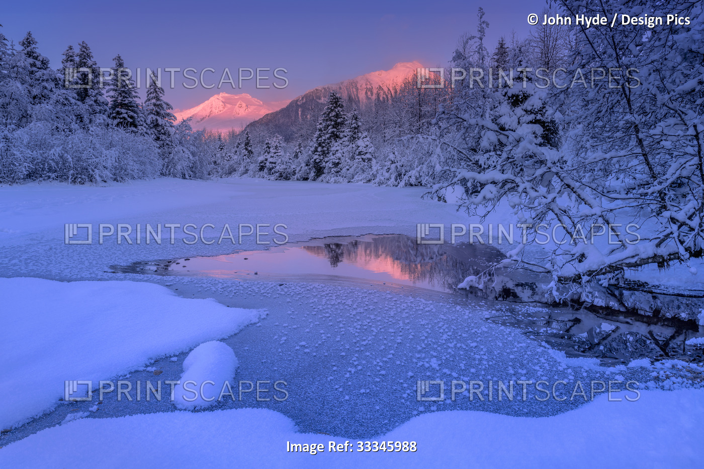 Tranquil winter scene of Mendenhall River in the Tongass National Forest with ...