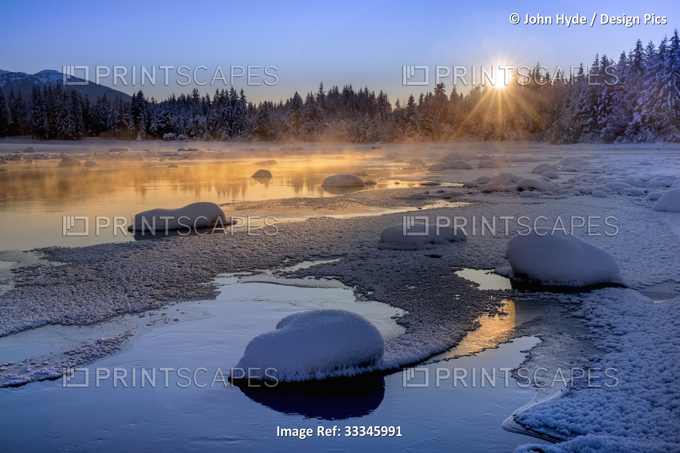 Tranquil winter scene of Mendenhall River in the Tongass National Forest with ...