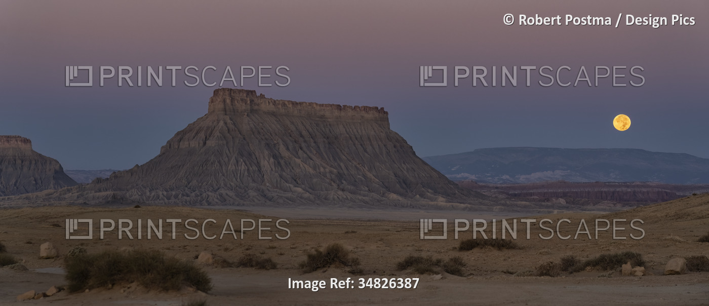 Beautiful Factory Butte and the moon setting in rural Utah, USA; Hanksville, ...
